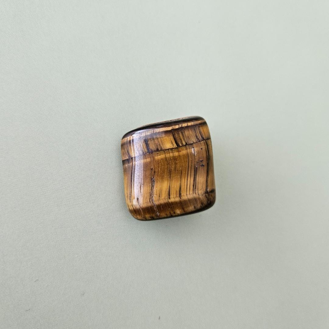 Tigers eye tumbled stone brown gold crystal protection focus confidenc