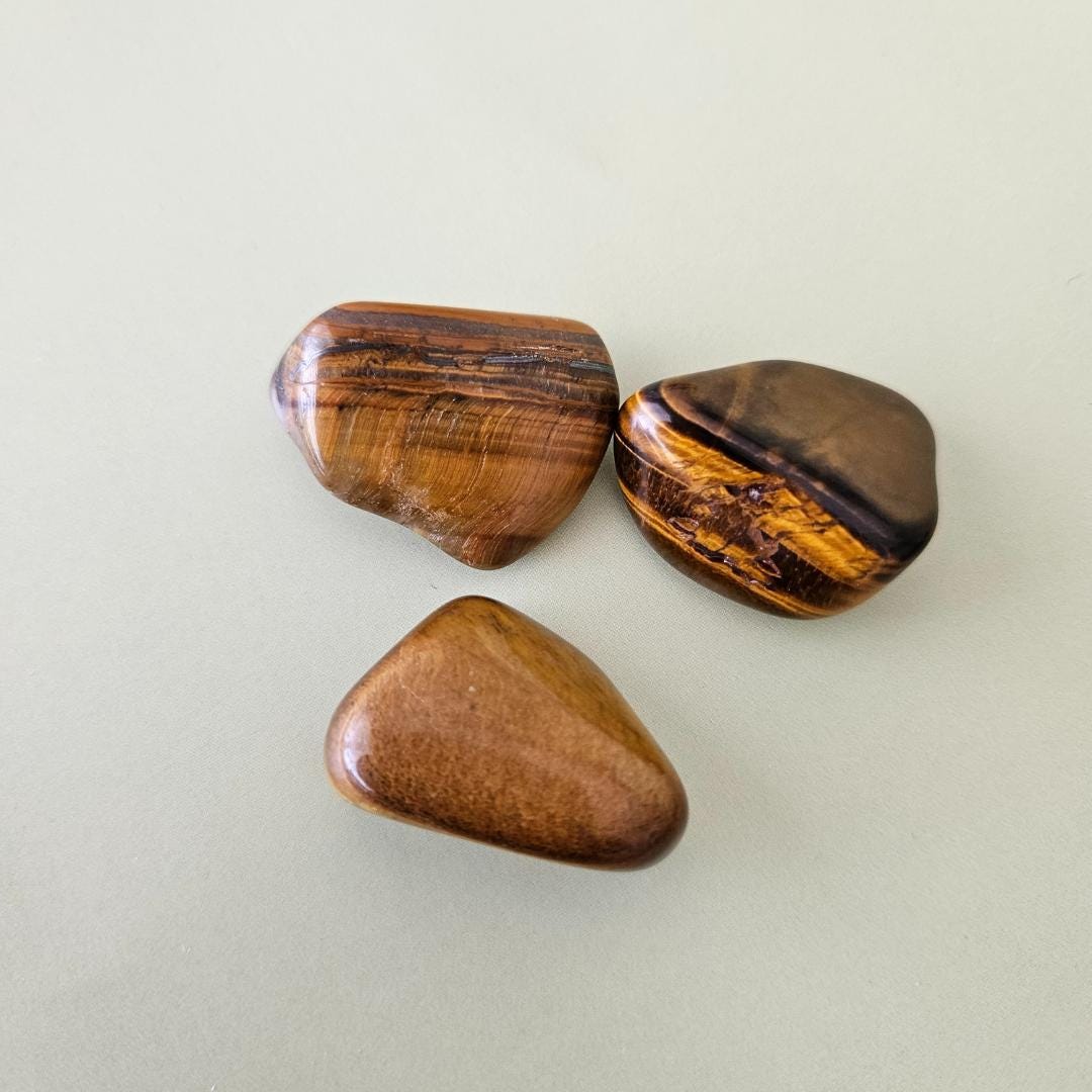 Tigers eye tumbled stone brown gold crystal protection focus confidenc