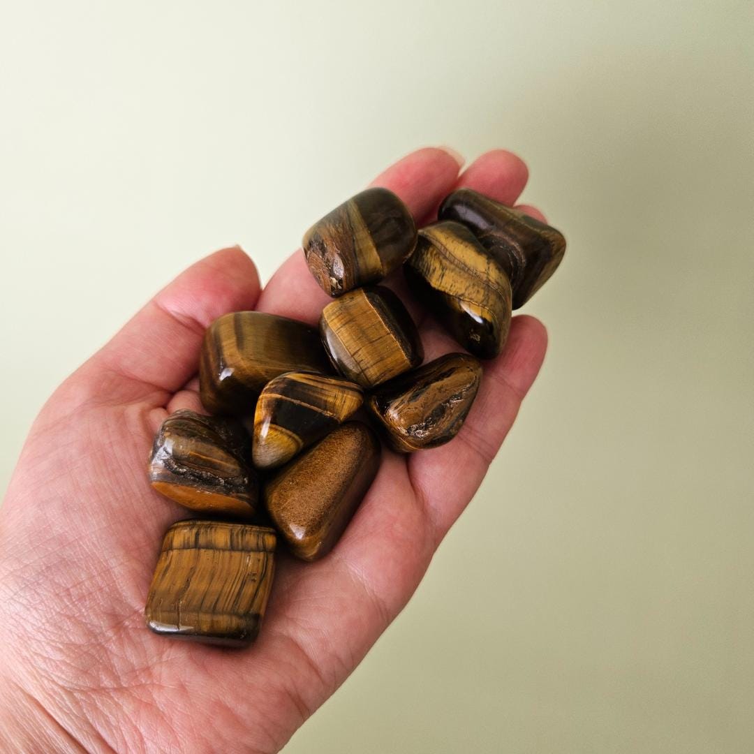 Tigers eye tumbled stone brown gold crystal protection focus confidenc